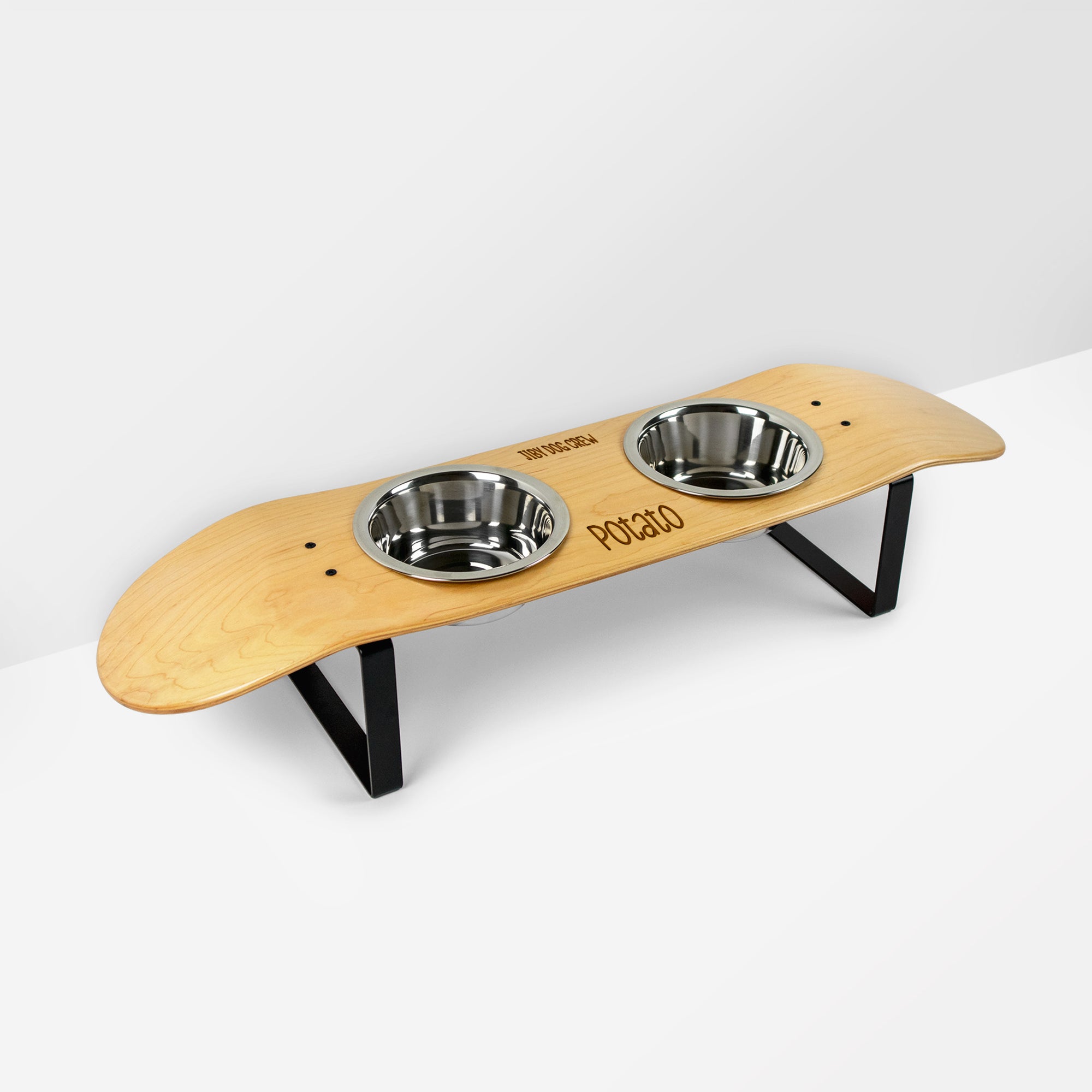 Skateboard dog bowl feeder stand handcrafted with custom designed art.