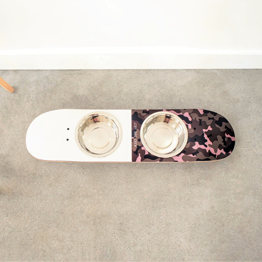 Handcrafted dog bowl stand made from repurposed skateboards featuring custom designed art.