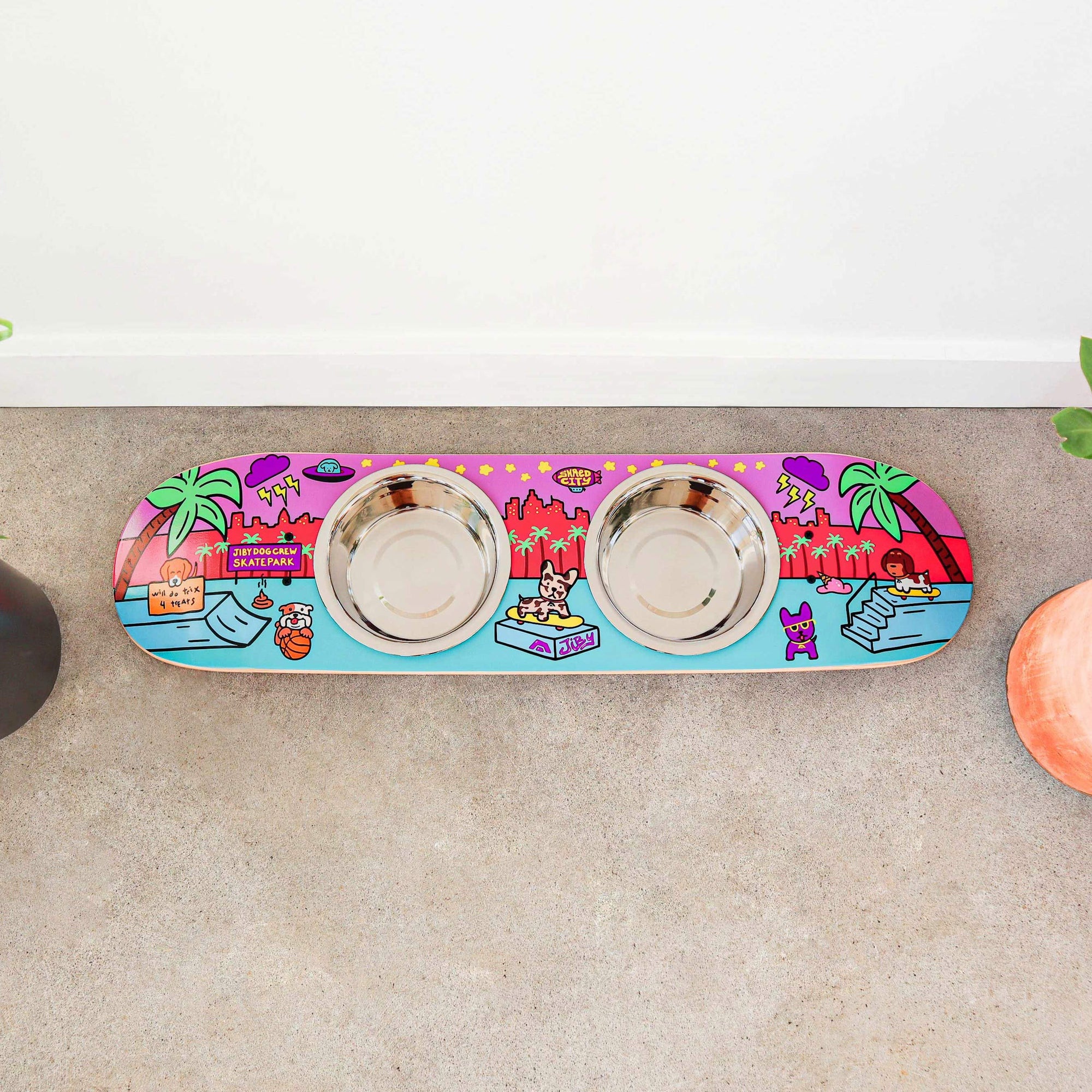 Skateboard dog bowl feeder stand handcrafted with custom designed art.