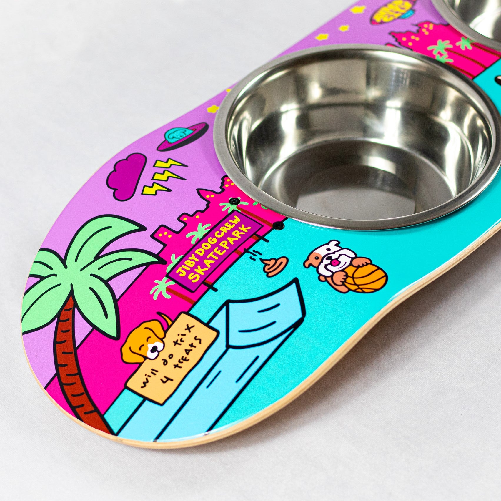 Skateboard dog bowl feeder stand handcrafted with custom designed art.