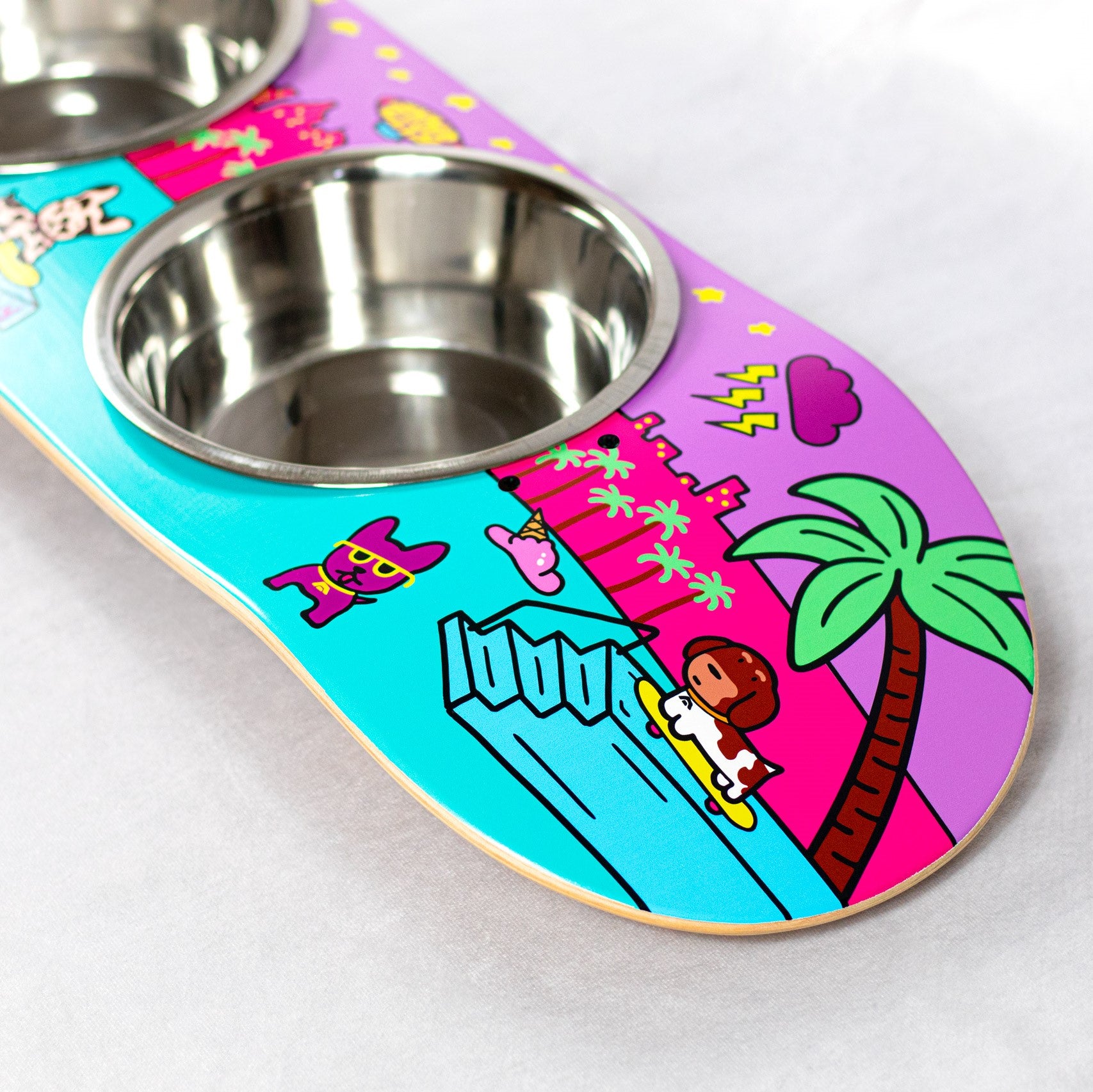 Skateboard dog bowl feeder stand handcrafted with custom designed art.